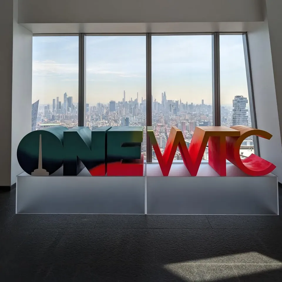 The view of Manhattan from the One World Observatory, with the One WTC sign