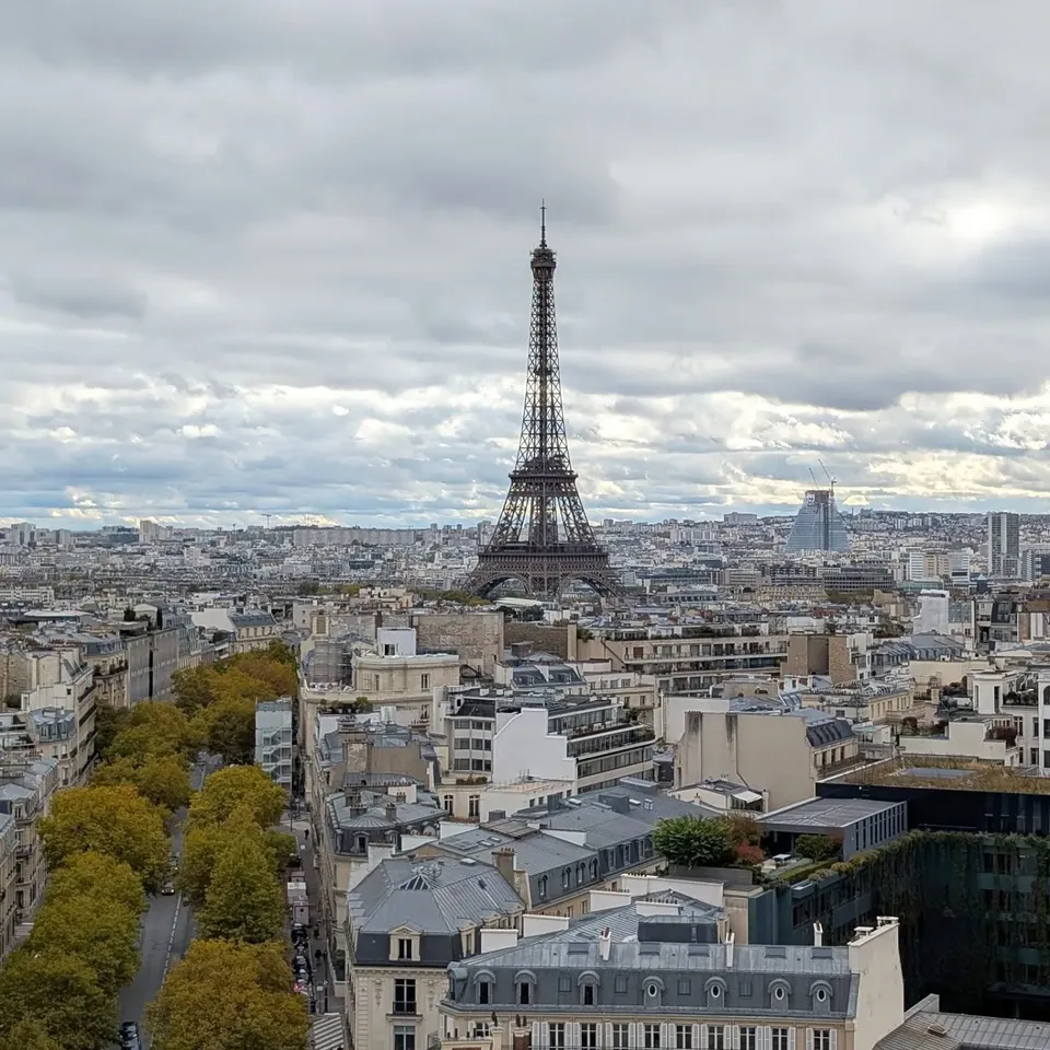 The Eiffel Tower rising above Paris rooftops