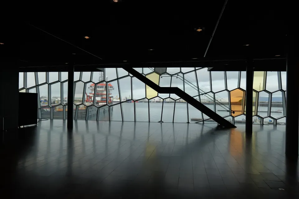 Inside the Harpa concert hall, looking out through its honeycomb glass wall to the harbour